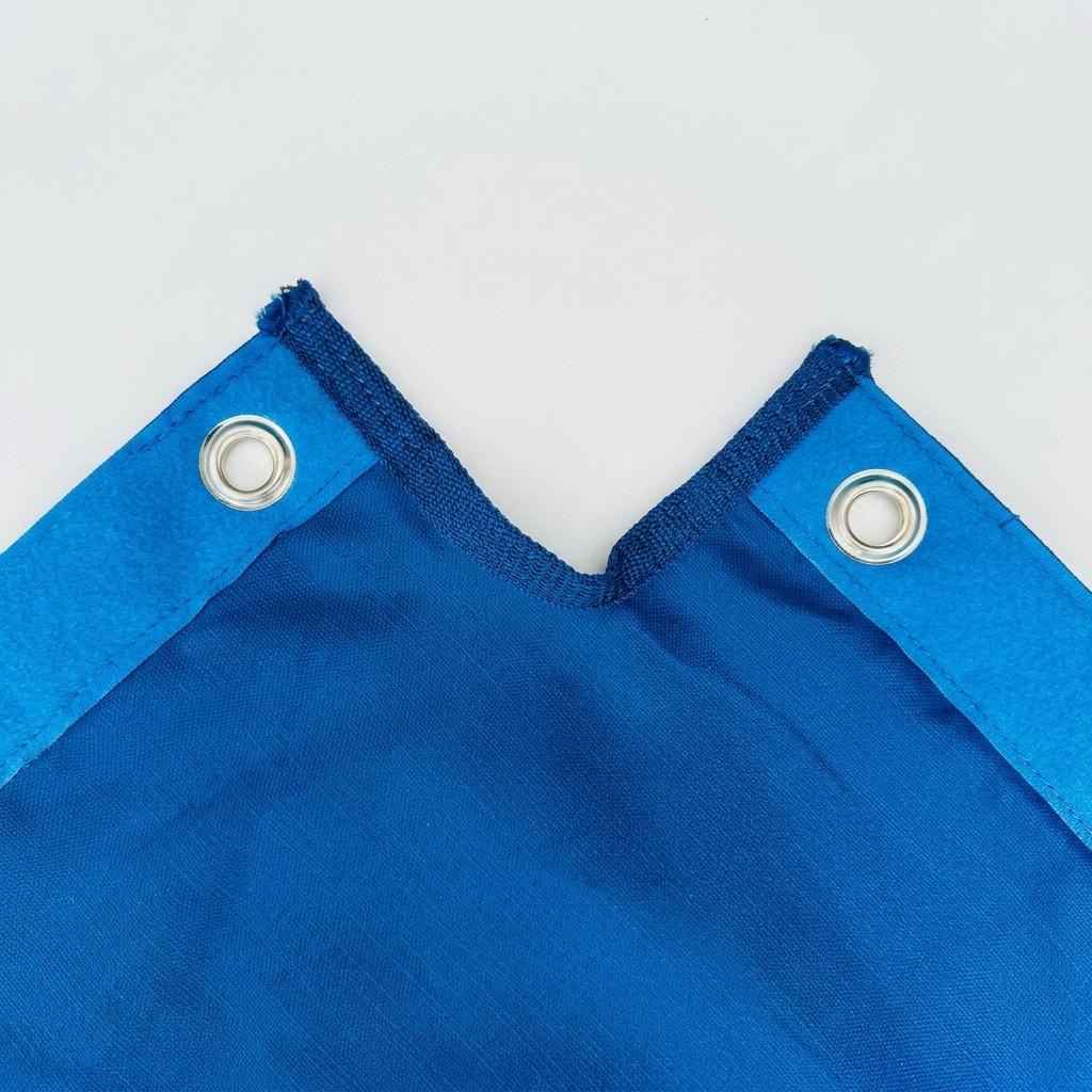 Pro Grade boxing ring canvas detail — reinforced grommets and Velcro edge strip